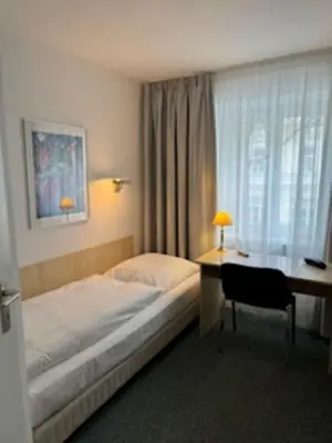 Ein Bett oder Betten in einem Zimmer der Unterkunft Hotel Occam