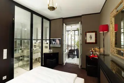 Ein Bett oder Betten in einem Zimmer der Unterkunft Hotel Opera