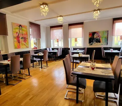 Ein Restaurant oder anderes Speiselokal in der Unterkunft Arthotel ANA Style Augsburg