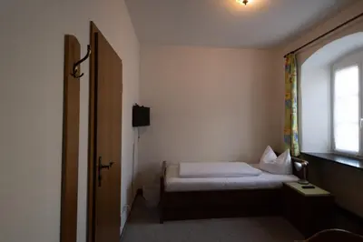 Ein Bett oder Betten in einem Zimmer der Unterkunft Bistro-Pension Vis-a-Vis