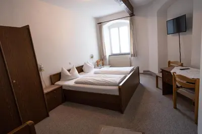 Ein Bett oder Betten in einem Zimmer der Unterkunft Bistro-Pension Vis-a-Vis