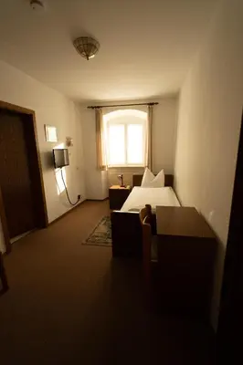 Ein Bett oder Betten in einem Zimmer der Unterkunft Bistro-Pension Vis-a-Vis