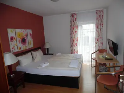 Ein Bett oder Betten in einem Zimmer der Unterkunft Hotel Edelweiß