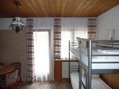 Ein Bett oder Betten in einem Zimmer der Unterkunft Hotel Edelweiß