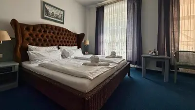 Ein Bett oder Betten in einem Zimmer der Unterkunft Altstadthotel Augsburg