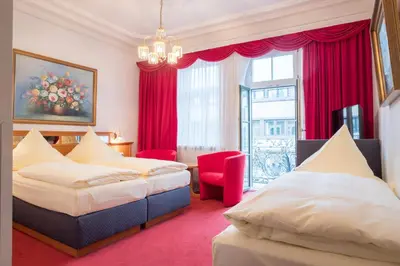 Ein Bett oder Betten in einem Zimmer der Unterkunft Hotel Bayernland