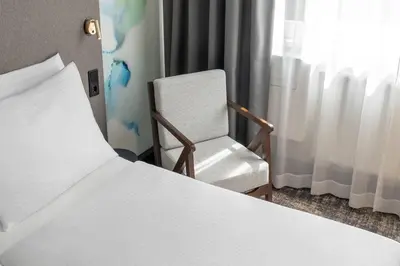 Ein Bett oder Betten in einem Zimmer der Unterkunft Wyndham Garden Munich Messe
