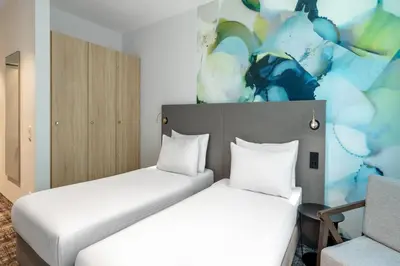 Ein Bett oder Betten in einem Zimmer der Unterkunft Wyndham Garden Munich Messe