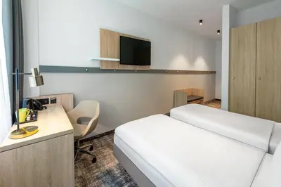 Ein Bett oder Betten in einem Zimmer der Unterkunft Wyndham Garden Munich Messe