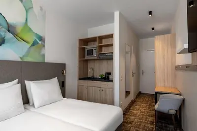 Ein Bett oder Betten in einem Zimmer der Unterkunft Wyndham Garden Munich Messe