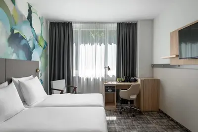 Ein Bett oder Betten in einem Zimmer der Unterkunft Wyndham Garden Munich Messe