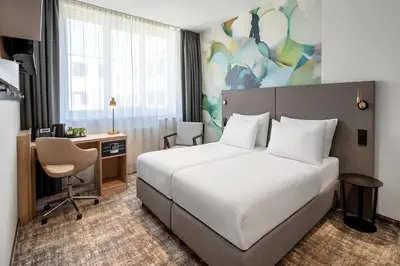 Ein Bett oder Betten in einem Zimmer der Unterkunft Wyndham Garden Munich Messe