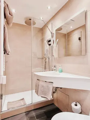 Ein Badezimmer in der Unterkunft Hotel Kriemhild am Hirschgarten