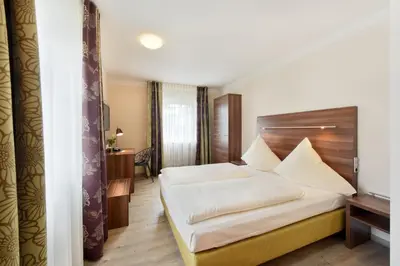 Ein Bett oder Betten in einem Zimmer der Unterkunft Hotel Säntis