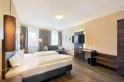 Ein Bett oder Betten in einem Zimmer der Unterkunft Hotel Säntis