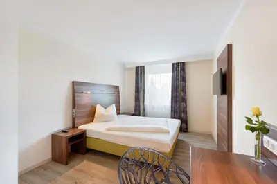 Ein Bett oder Betten in einem Zimmer der Unterkunft Hotel Säntis