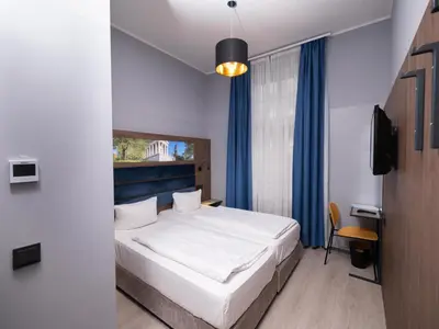 Ein Bett oder Betten in einem Zimmer der Unterkunft Smart Stay Hotel Station