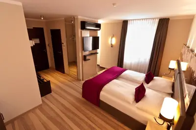 Ein Bett oder Betten in einem Zimmer der Unterkunft Amalienburg - Boutique & Boarding Hotel