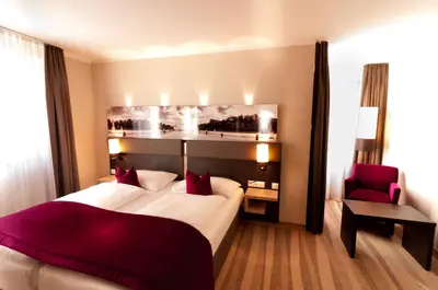 Ein Bett oder Betten in einem Zimmer der Unterkunft Amalienburg - Boutique & Boarding Hotel