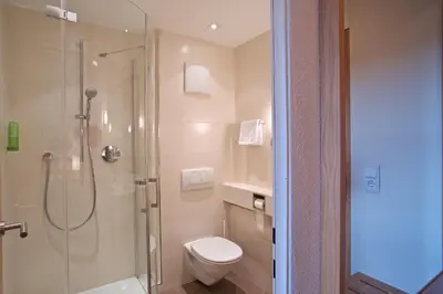 Ein Badezimmer in der Unterkunft Hotel zur Mühle