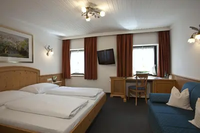 Ein Bett oder Betten in einem Zimmer der Unterkunft Hotel zur Mühle