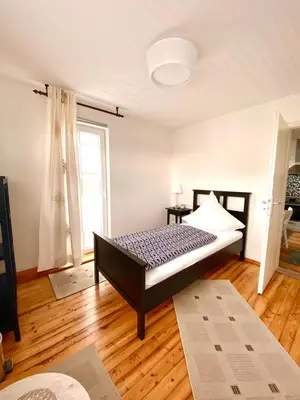 Ein Bett oder Betten in einem Zimmer der Unterkunft Ferienwohnung