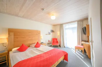 Ein Bett oder Betten in einem Zimmer der Unterkunft Biohotel Garmischer Hof