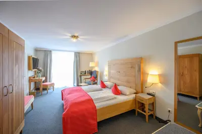 Ein Bett oder Betten in einem Zimmer der Unterkunft Biohotel Garmischer Hof