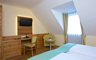 Ein Bett oder Betten in einem Zimmer der Unterkunft Hotel am Schloßberg