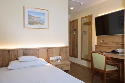 Ein Bett oder Betten in einem Zimmer der Unterkunft Hotel am Schloßberg