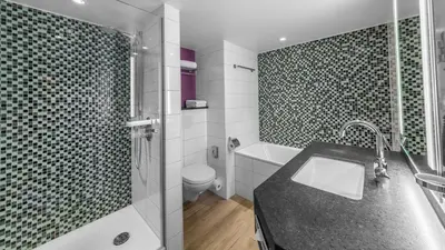 Ein Badezimmer in der Unterkunft Holiday Inn Munich City Centre by IHG