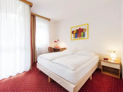 Ein Bett oder Betten in einem Zimmer der Unterkunft Andante Hotel Erding