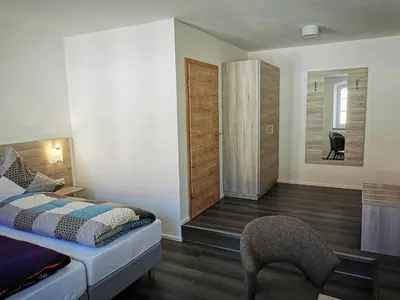 Ein Bett oder Betten in einem Zimmer der Unterkunft Pension unterm Schlossturm