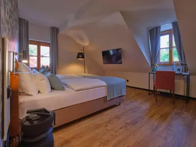 Ein Bett oder Betten in einem Zimmer der Unterkunft Classik Hotel Martinshof, Messe München