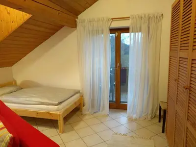 Ein Bett oder Betten in einem Zimmer der Unterkunft Komfortabel wohnen am Waldrand von Pitzling