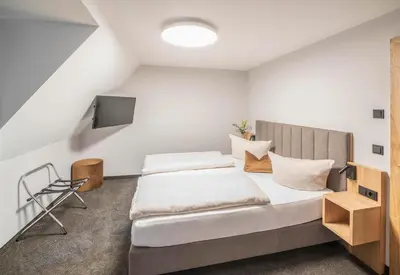 Ein Bett oder Betten in einem Zimmer der Unterkunft Langwieder See