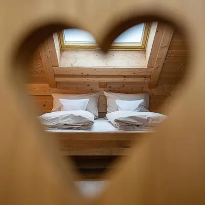 Ein Bett oder Betten in einem Zimmer der Unterkunft Alpinum Junior