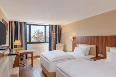 Ein Bett oder Betten in einem Zimmer der Unterkunft NH Ingolstadt