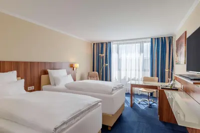 Ein Bett oder Betten in einem Zimmer der Unterkunft NH Ingolstadt