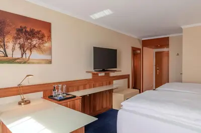 Ein Bett oder Betten in einem Zimmer der Unterkunft NH Ingolstadt