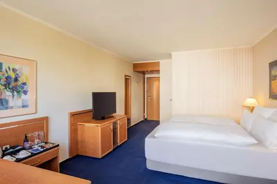 Ein Bett oder Betten in einem Zimmer der Unterkunft NH Ingolstadt