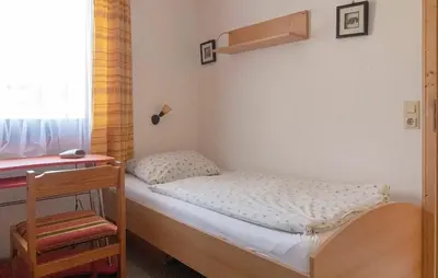 Ein Bett oder Betten in einem Zimmer der Unterkunft Ferienhaus Nr 76, Kategorie Economy, Feriendorf Hochbergle, Allgäu