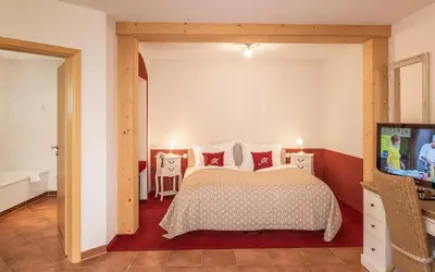 Ein Bett oder Betten in einem Zimmer der Unterkunft Hotel Mutz Garni