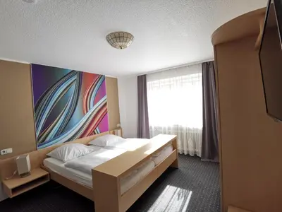 Ein Bett oder Betten in einem Zimmer der Unterkunft Jakoberhof