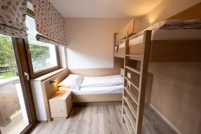 Ein Bett oder Betten in einem Zimmer der Unterkunft Das Bayrischzell Familotel Oberbayern