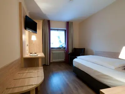 Ein Bett oder Betten in einem Zimmer der Unterkunft Hotel-Gasthof Sperrer