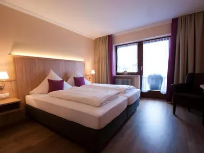 Ein Bett oder Betten in einem Zimmer der Unterkunft Hotel-Gasthof Sperrer