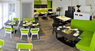 Ein Restaurant oder anderes Speiselokal in der Unterkunft Amiga Hotel München Messe