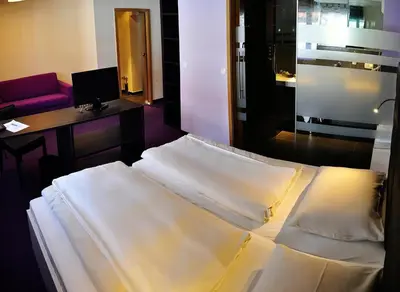 Ein Bett oder Betten in einem Zimmer der Unterkunft Amiga Hotel München Messe