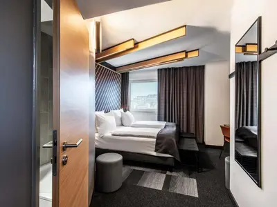 Ein Bett oder Betten in einem Zimmer der Unterkunft B&B HOTEL München-Messe